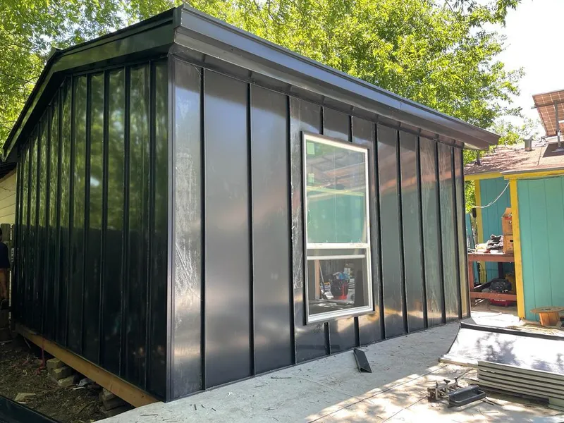 Black standing seam metal wall panels for Metal Roof Installation in Dunbar