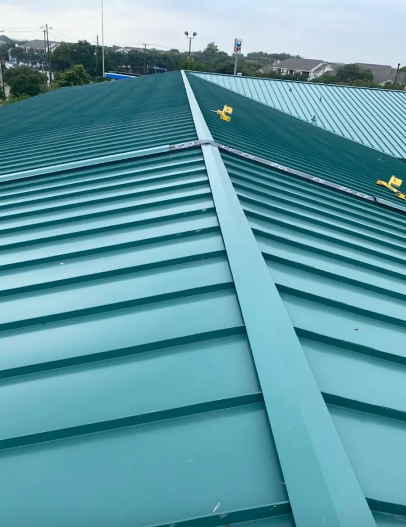 Green commercial metal roof ridge and valley for Metal Roof Repair in Dunbar
